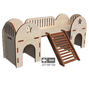May include: Wooden hamster house with two entrances, a ramp, and a platform. The house is made of light wood with a natural finish. The ramp is made of dark wood with a natural finish. The house is 321 mm wide, 98 mm deep, and 128 mm high.