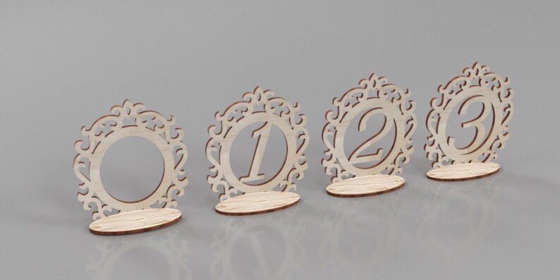 May include: Four wooden table number holders with ornate designs. The numbers 1, 2, and 3 are visible.
