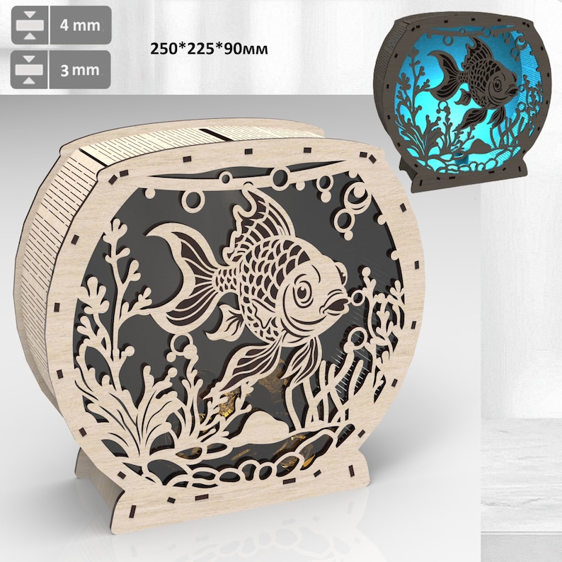 May include: A wooden cutout of a fishbowl with a single goldfish inside. The fishbowl is 250mm x 225mm x 90mm and has a detailed design of bubbles and seaweed. The fishbowl is made of light brown wood and has a black background.