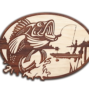 May include: A wooden cutout of a bass fish leaping from the water, with a fishing rod and a fisherman in the background. The cutout is on a light brown background.