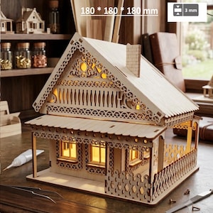 May include: A light-colored wooden model house featuring intricate laser-cut decorative trim, a chimney, and illuminated windows. The structure measures 180 by 180 by 180 mm with a material thickness of 3 mm, showcasing detailed craftsmanship.