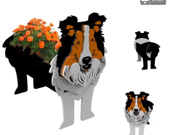 May include: A black, white, and orange wooden planter shaped like a Collie dog. The planter has a space for flowers or plants in the dog's body. The planter is 8 mm thick.