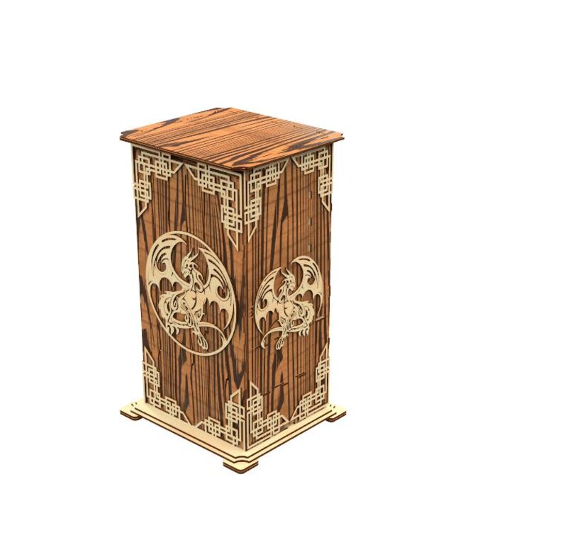 May include: A wooden box with a dragon design. The box is rectangular with a decorative top and base. The sides feature laser-cut dragon silhouettes within oval frames and geometric patterns. The wood has a warm, natural tone.
