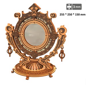 Puede incluir: Un espejo decorativo de madera con intrincadas tallas y un marco circular. El espejo mide 25,5 x 25 x 15 cm y tiene 3 mm de grosor. El marco presenta texto y detalles ornamentales, con acentos colgantes en forma de linterna. El espejo tiene una combinación de colores marrón claro y oscuro.