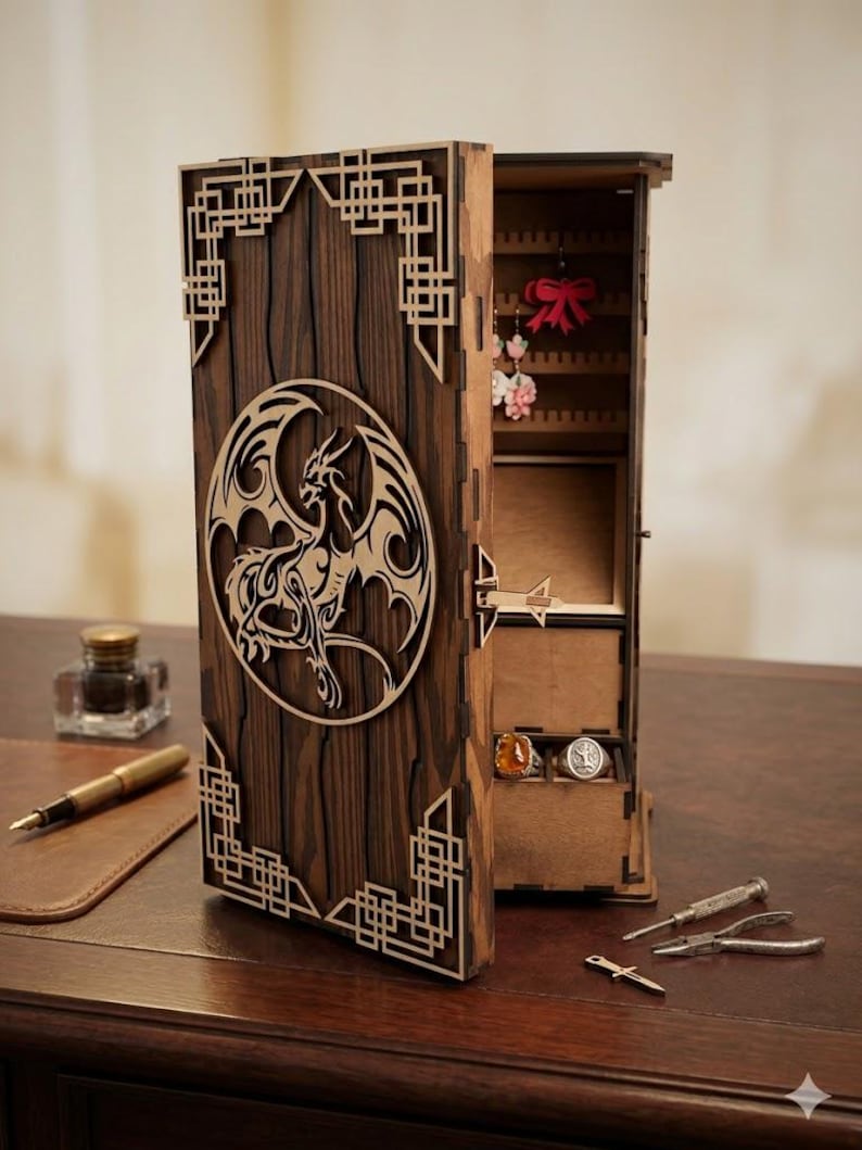 May include: A wooden jewelry box with a dragon design. The box is made of dark brown wood with a laser-cut dragon in a circle on the front. The box is open, revealing compartments for jewelry. The box has a decorative geometric design on the edges.