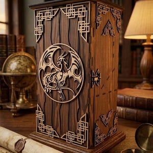 May include: A wooden box with a dragon design. The box is made of dark brown wood with intricate laser-cut patterns and a circular dragon emblem. The design includes geometric shapes and a detailed dragon silhouette, creating a decorative storage item.