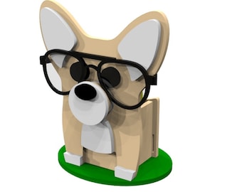 Könnte beinhalten: Eine Holzfigur eines Hundes mit Sonnenbrille. Der Hund sitzt auf einem grünen Sockel. Die Figur ist 6 mm dick.