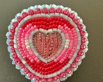 Shiny pink center heart earrings