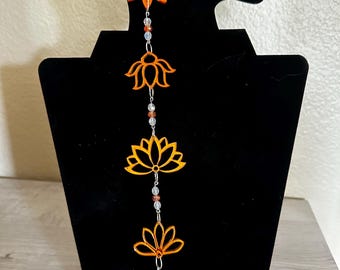 Orange floral mirrored acrylic earrings