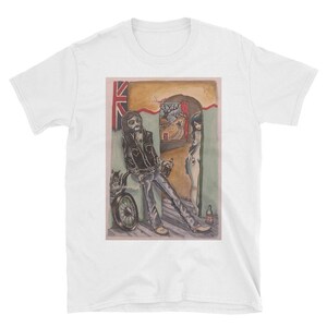 May include: A white t-shirt with a vintage illustration of a man with a motorcycle and a woman standing in a doorway. The illustration is in a cartoon style and features a Union Jack flag in the background.