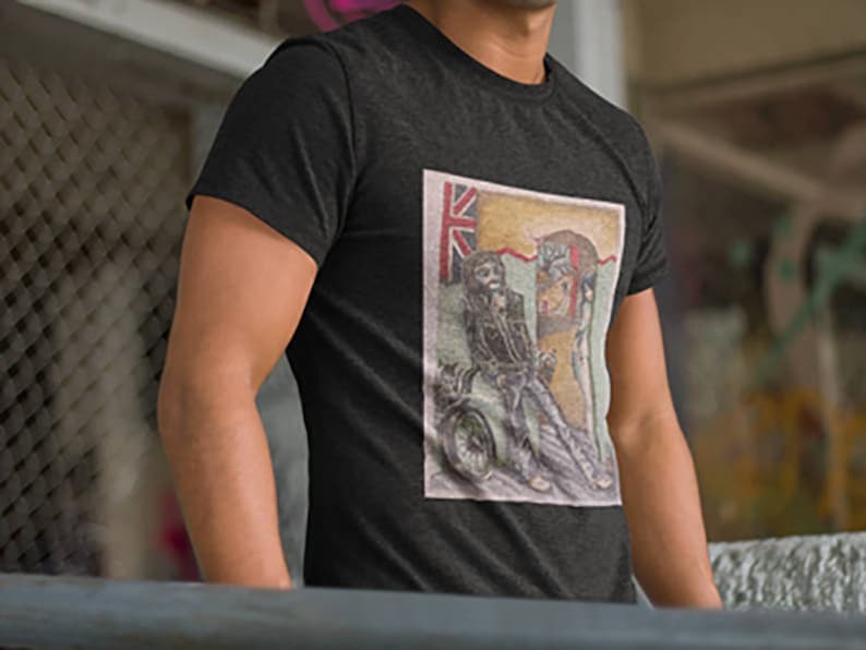May include: A dark heather grey t-shirt with a vintage-style illustration of a person riding a motorcycle. The illustration includes a Union Jack flag and the text "The King's Road".