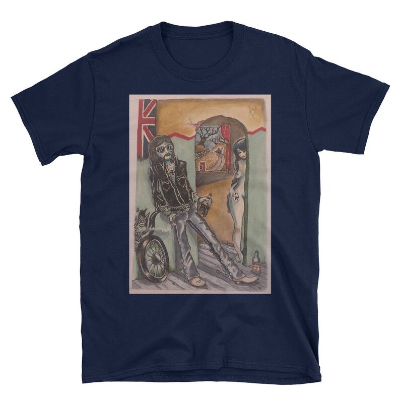 May include: A navy blue t-shirt with a vintage illustration of a man with a motorcycle and a woman standing in a doorway. The illustration is in a cartoon style and features a Union Jack flag in the background.