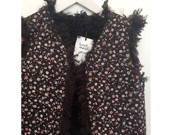 Shepherd reversible vest faux fur comforter and chocolate flowers