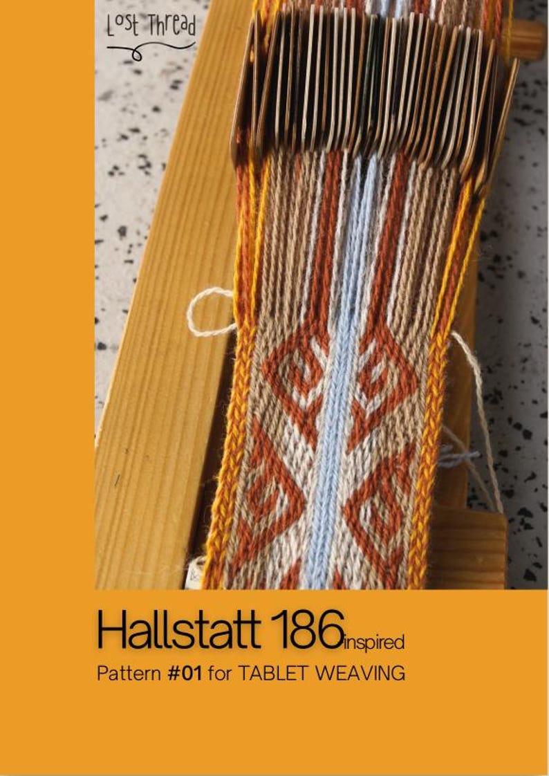 May include: Tablet weaving project in progress, featuring a Hallstatt 186 inspired pattern. The woven fabric displays a geometric design in shades of orange, brown, white, and blue. The text "Lost Thread" and "Pattern #01 for TABLET WEAVING" are visible.