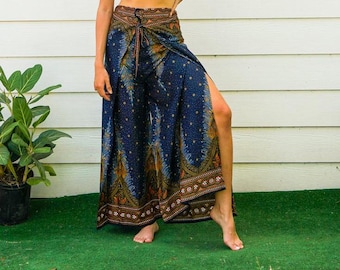 May include: A blue and brown patterned wrap skirt with a high waist and a side slit. The skirt is made of a soft, flowing fabric and has a bohemian style.