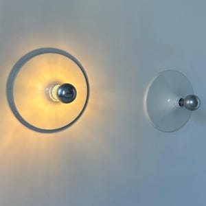 Pair of vintage wall lights, white lacquered metal, Italy 1970.
