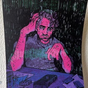 May include: Illustration of a man with curly hair, looking stressed, with his hand on his head. The artwork uses pink, purple, green, and black colours. The man is sitting at a table with a mug, cassettes, and a notepad.