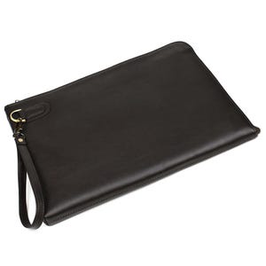 May include: A dark brown leather clutch with a wrist strap. The rectangular clutch has a smooth surface and a gold-colored metal clasp. The wrist strap is attached to the clutch with a small gold-colored metal ring.