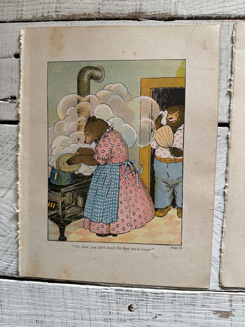 May include: An illustration of two bears in a kitchen. The bear on the left is wearing a pink and blue dress and is stirring a pot on a stove. The bear on the right is wearing a blue and white shirt and is holding a fan. The text "No, dear, you can't stand this heat much longer" is printed below the image.