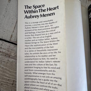 May include: A vintage paperback book cover with a white background and black text. The title is "The Space Within The Heart" by Aubrey Menen. The book cover features a price of &pound;5.95.