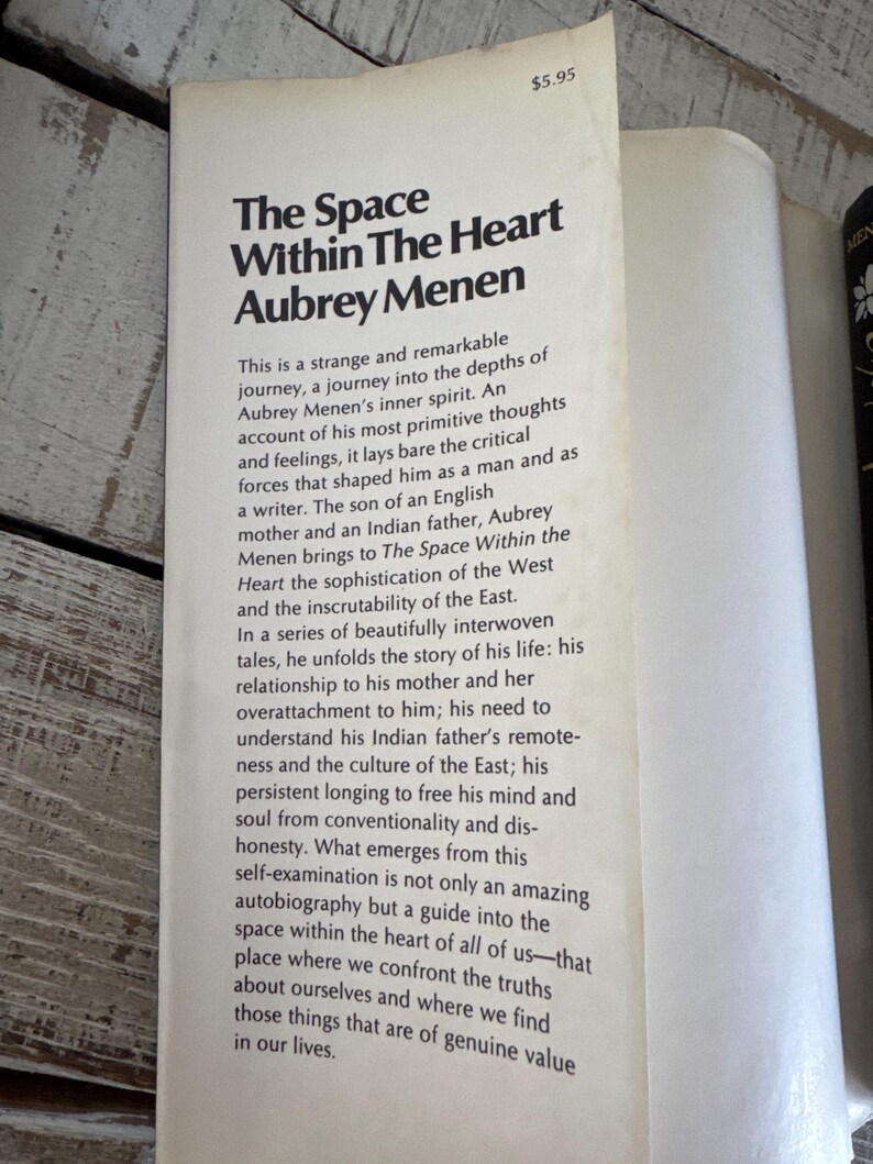 May include: A vintage paperback book cover with a white background and black text. The title is "The Space Within The Heart" by Aubrey Menen. The book cover features a price of &pound;5.95.