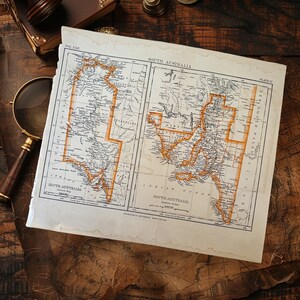 May include: An antique map of South Australia, printed on paper with a brown, aged appearance. The map is divided into sections, each labelled with a name and a number. The map is surrounded by a white border.