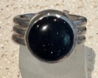 Rustic handmade sterling silver triple ring with blue sandstone cabochon.