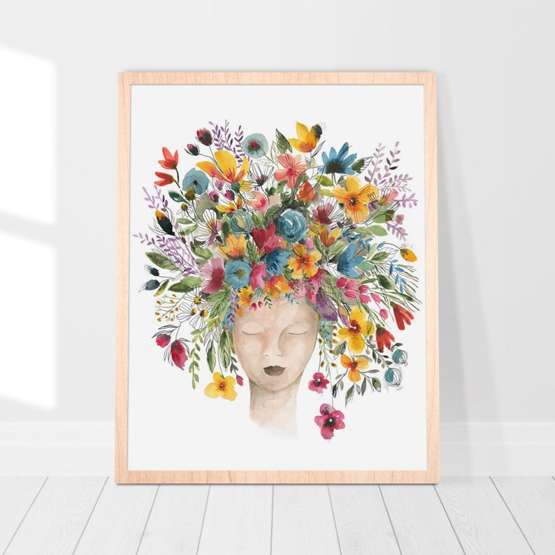 May include: Watercolor painting of a person with their eyes closed, surrounded by a colorful floral crown. The flowers are in shades of pink, yellow, blue, and green.