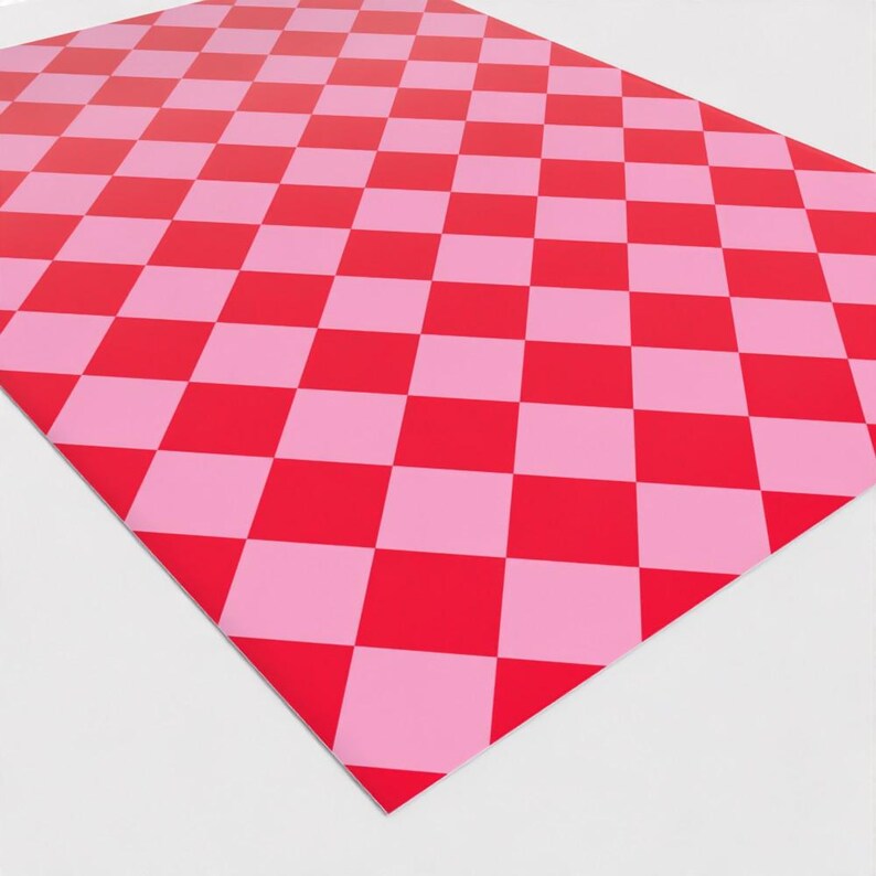May include: Checkered wrapping paper with a pink and red diamond pattern.