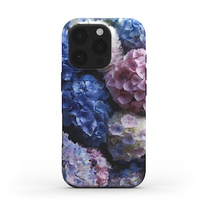 May include: A smartphone case featuring a vibrant floral design. The case showcases a close-up of blue, pink, and white hydrangea blossoms. The case has a black border and a camera cutout.