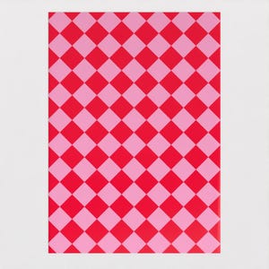 May include: Pink and red checkered wrapping paper. The paper has a repeating pattern of pink and red squares.