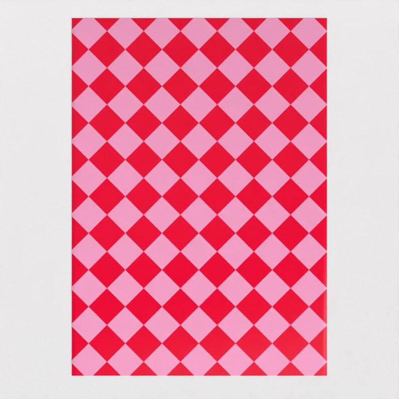 May include: Pink and red checkered wrapping paper. The paper has a repeating pattern of pink and red squares.
