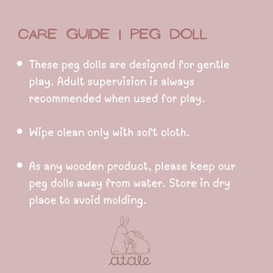 May include: A pink background with white text that reads "CARE GUIDE | PEG DOLL." The text provides care instructions for peg dolls, including gentle play, adult supervision, and cleaning with a soft cloth. The image also features a bunny logo.