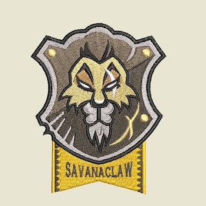 May include: A gold and brown embroidered patch with a lion's face and the text "SAVANACLAW" on a yellow banner.