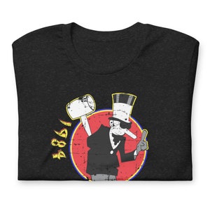 May include: Black t-shirt with a distressed red, yellow, and blue circle graphic featuring a cartoon character with a top hat, sunglasses, and a long nose holding a hammer. The text "4881" is printed in yellow on the left side of the graphic.