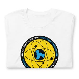 May include: White t-shirt with a yellow circle graphic featuring a black atom symbol with a blue center. The text around the circle reads "Intergalactic Planetary Intergalactic Another Dimension".