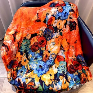Luxurious soft silk scarf. Orange and blue floral design. Gift box available for a small extra charge. Great Mother's Day gift!