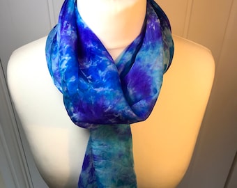 Delicate silk scarf is hand painted with vibrant silk dyes on a stretcher frame and then steam set. 35cmx180cm