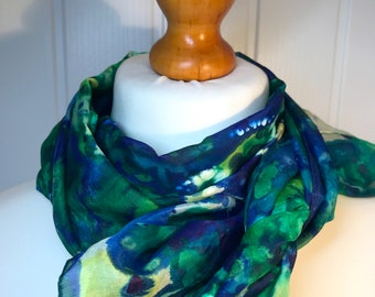 Unique delicate silk scarf is hand painted with vibrant silk dyes on a stretcher frame and then steam set.'Personalised' gift box available.