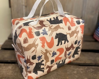 Large toiletry bag in waterproof coated fabric, vanity case in coated fabric with forest animal motifs