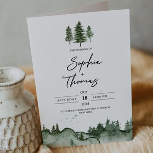 May include: Wedding invitation with a watercolor illustration of a forest scene. The text reads "The Wedding of Sophia + Thomas, Saturday, October 18, 2024, 1:00 PM, St. Patrick's Roman Catholic Church, New York."
