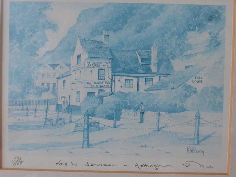 May include: A blue and white monochromatic print depicting the Ye Olde Trip to Jerusalem inn in Nottingham. The artwork features the building facade with text reading Ye Olde Jerusalem and The Oldest Inn In England, signed by the artist K.W. Burton.