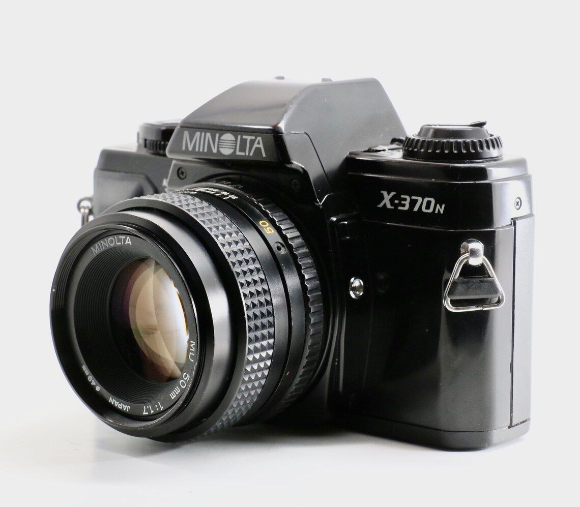 Fully functional Minolta X370N w 50mm prime lens. Etsy
