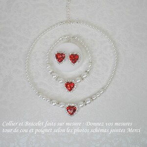 May include: A set of red heart-shaped jewelry with pearl necklaces and earrings. The necklace is a double strand of pearls with a large red heart pendant. The bracelet is a single strand of pearls with a smaller red heart pendant. The earrings are small red heart studs.
