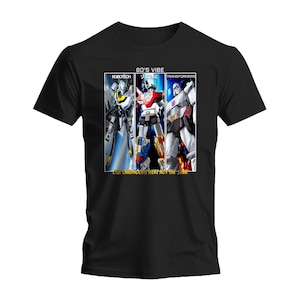 May include: Black t-shirt featuring a graphic design with three robot characters from the 80s: Robotech, Voltron, and Transformers. The text "80's Vibe" and "OUR CHILDHOODS WERE NOT THE SAME" are also printed on the shirt.