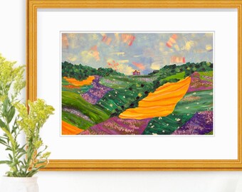 Può includere: Un dipinto incorniciato di un paesaggio colorato con colline ondulate, una piccola casa e un cielo blu con nuvole rosa. Il dipinto è in una cornice dorata ed è appeso a una parete bianca.