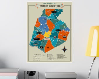 Può includere: Una stampa colorata della mappa intitolata "The Wineries of Frederick County, MD". La mappa presenta varie sezioni colorate che rappresentano diverse aree, con illustrazioni di animali e una rosa dei venti. La stampa è esposta su una parete bianca.
