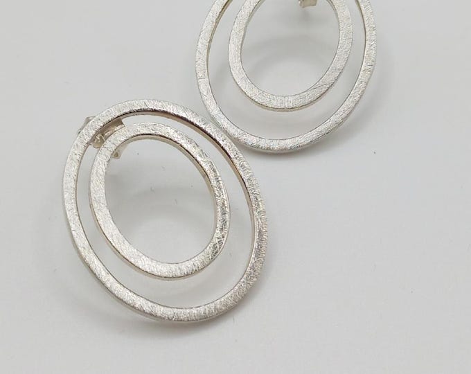 Hand-forged double circle earrings, 925 sterling silver, coarsely matted, timeless and modern.