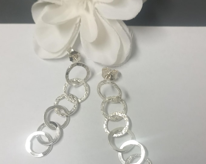 Earrings with small, hand-forged 925 sterling silver rings.