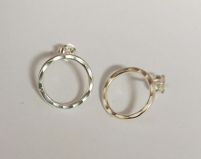 Sterling silver small handmade stud earrings with hammered structure.